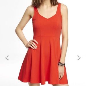 Express women’s orange v-neck skater mini dress with back zipper, size small.